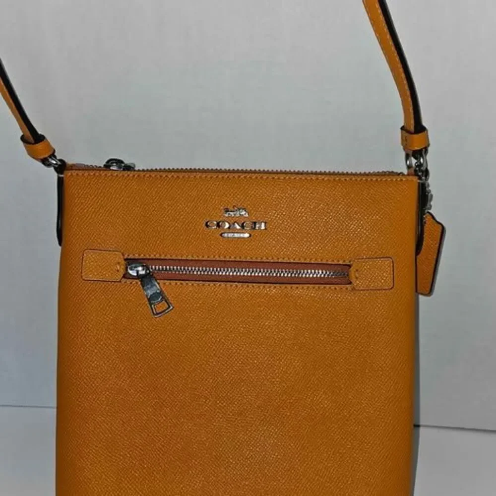 Coach Papaya Solid Crossbody Bag Zip Closure Adjustable Strap Inner Pockets